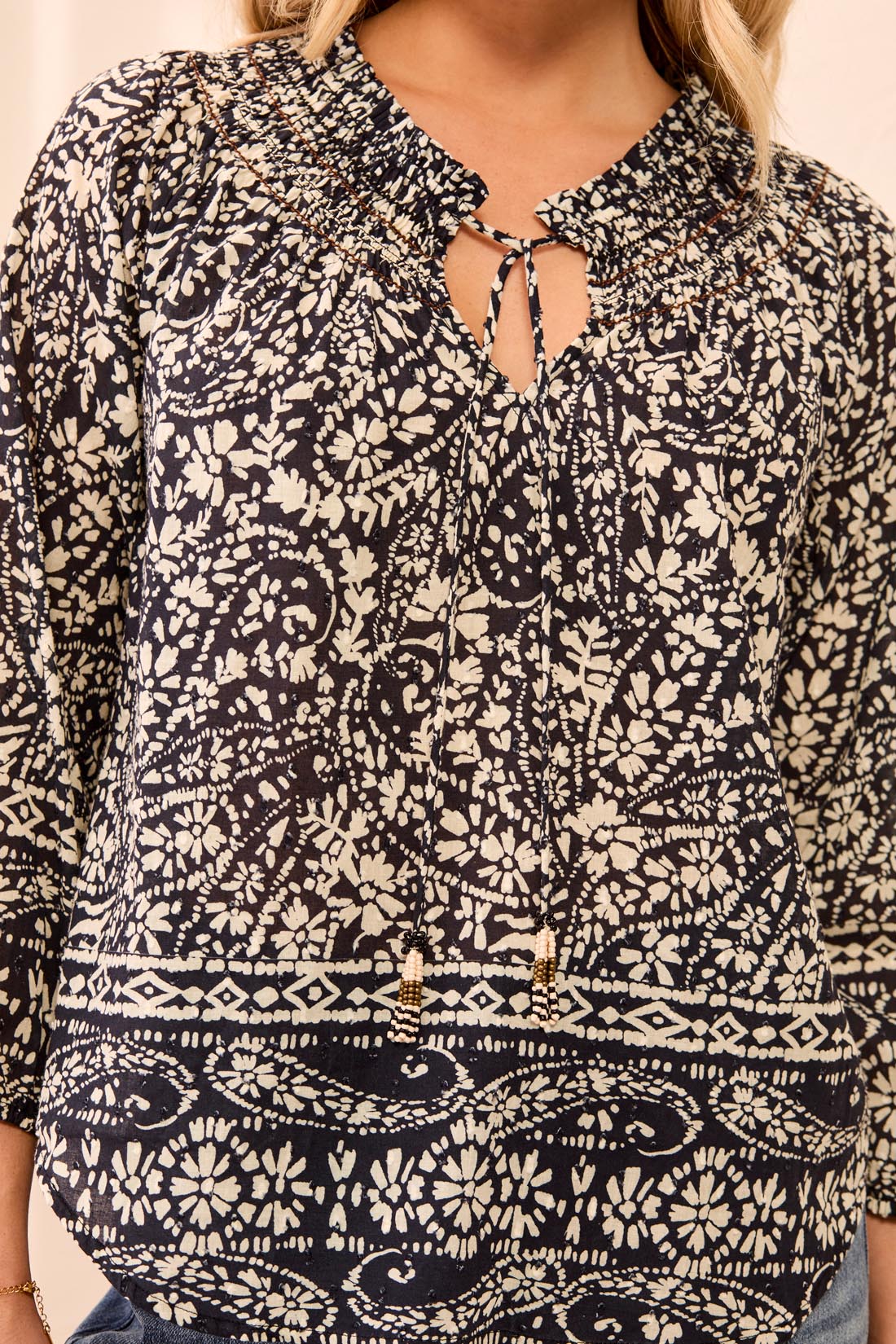 BLOUSE W/ FANCY EMBROIDERY & TASSEL-BLACK/WHITE